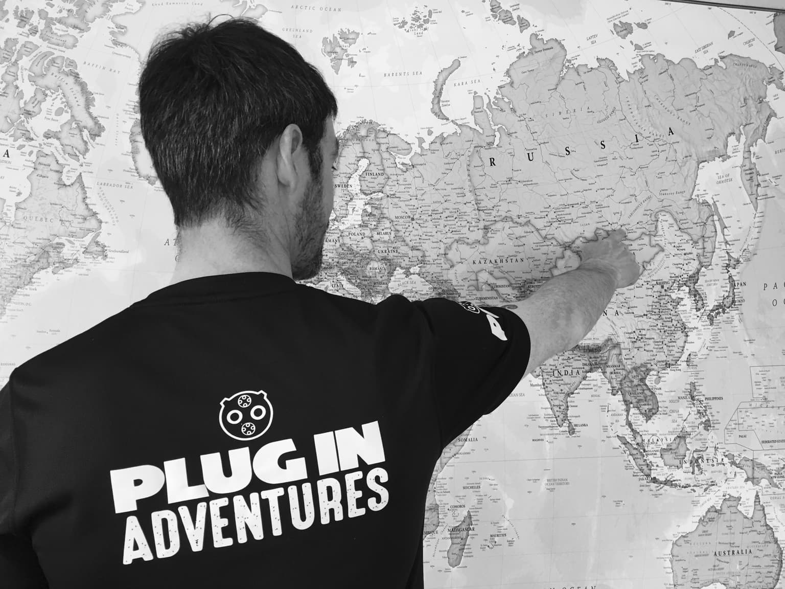 Chris Ramsey from Pole to Pole with world map