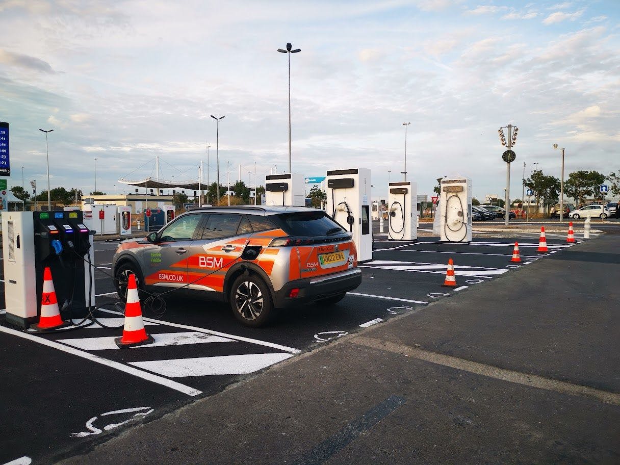 Photograph of peugeot e-208 charging at a slow charger in Calais, France
