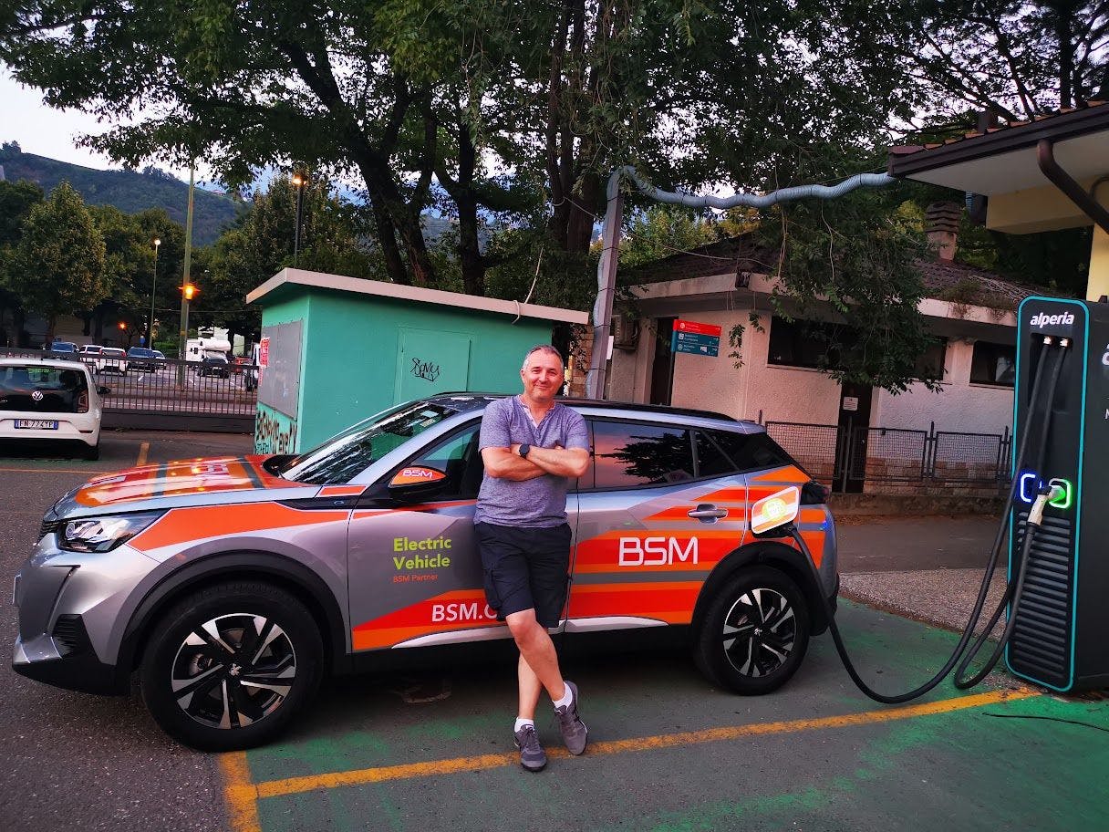 Photograph of peugeot e-208 charging in Merano, Italy