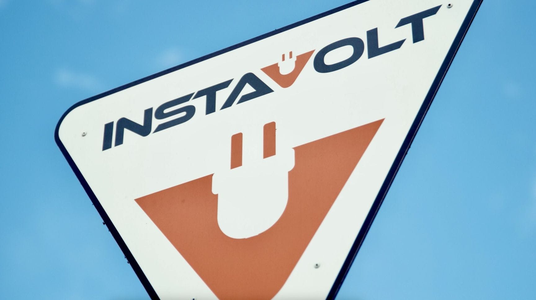 InstaVolt logo on a sign post