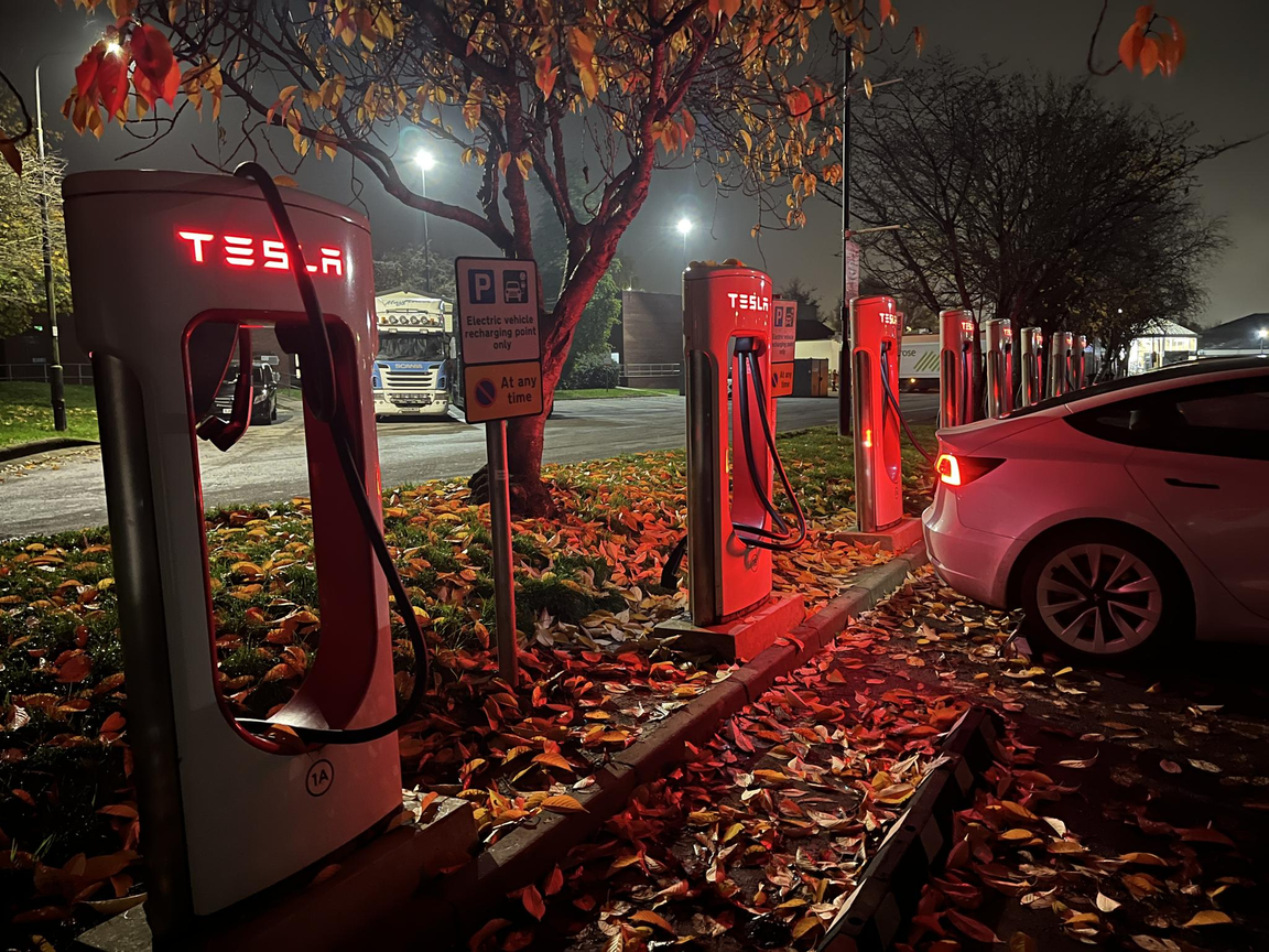 Photo submission winner for the Octopus Electric Universe monthly photo competition. The photo shows a dark night illuminated by Tesla EV charging stations.