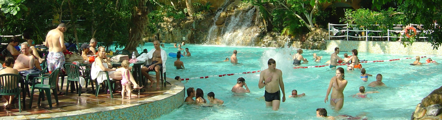 Photo of Center Parcs swimming pool, taken by Photo Credit: De Vossemeren - https://commons.wikimedia.org/wiki/File:Center_Parcs_-_De_Vossemeren,_2004.jpg