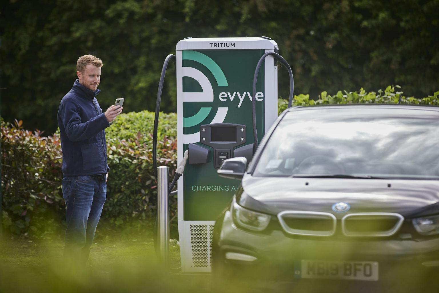 evyve ev charging station being used to charge an ev