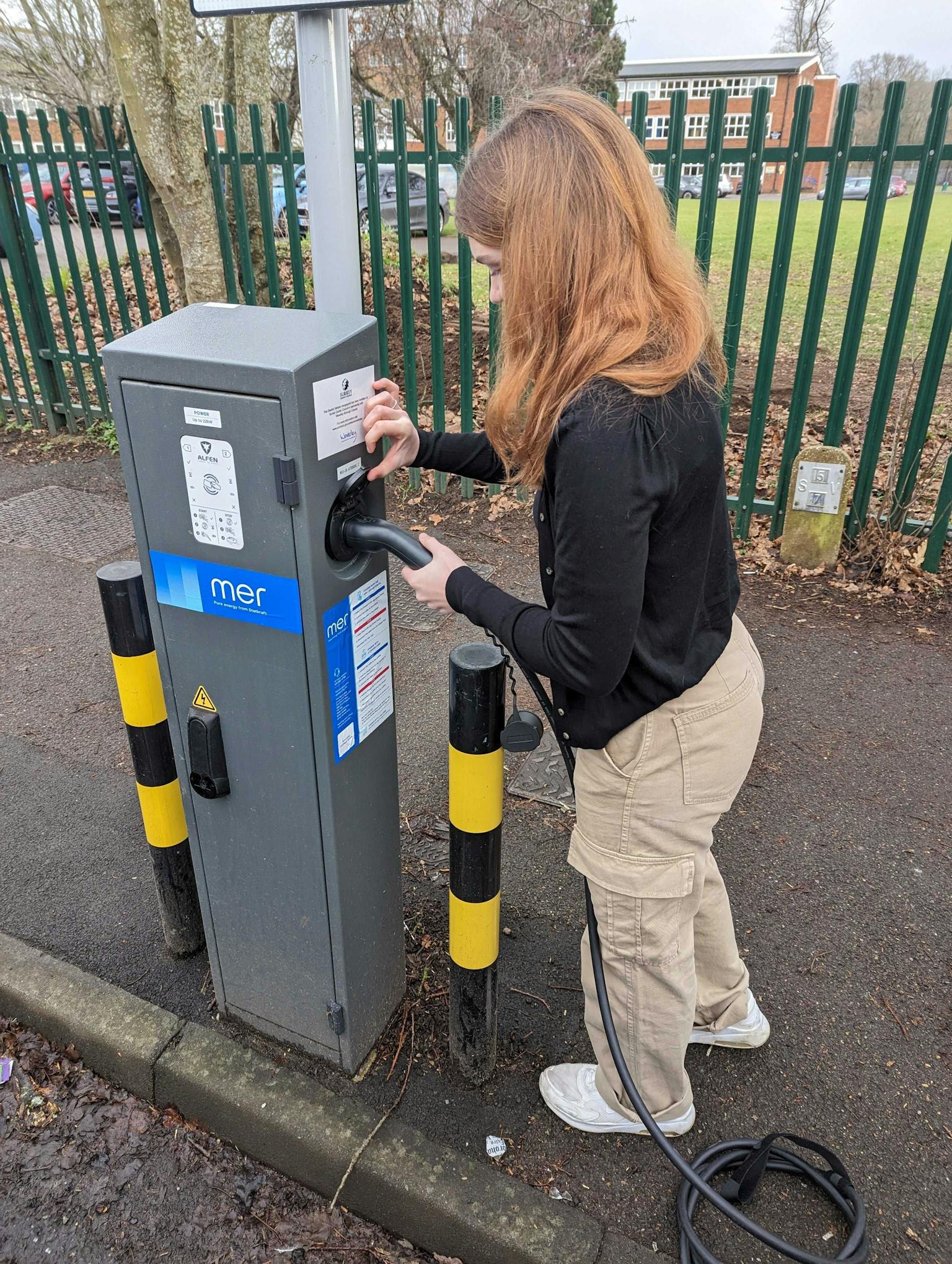woman using MER electric charge point 